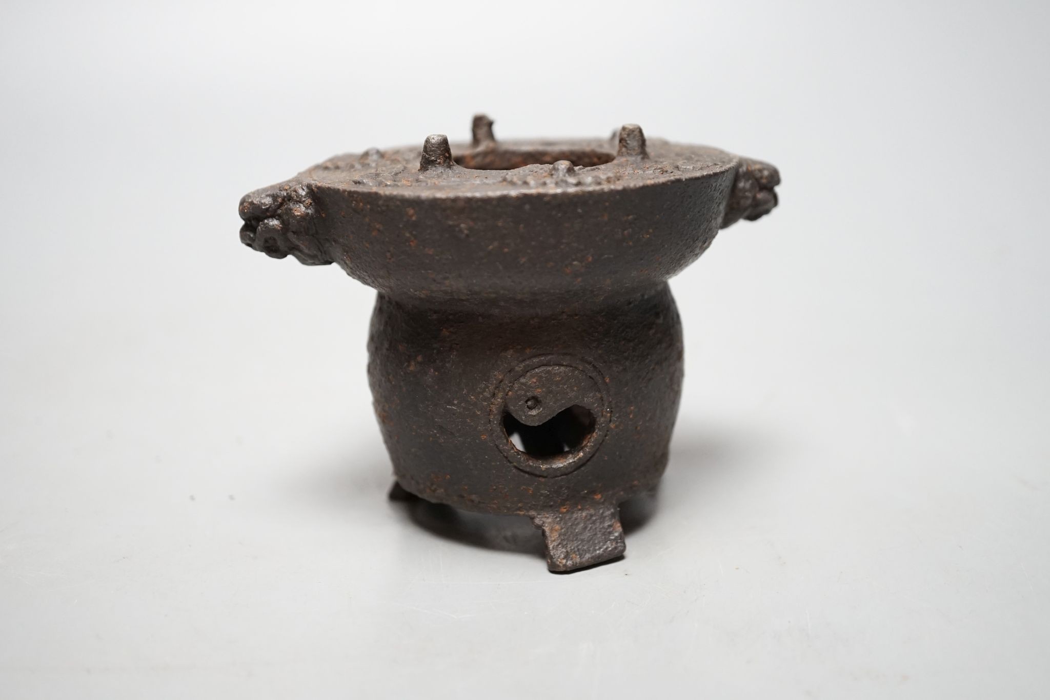 A Japanese cast iron burner stand, 6.5 cms high.